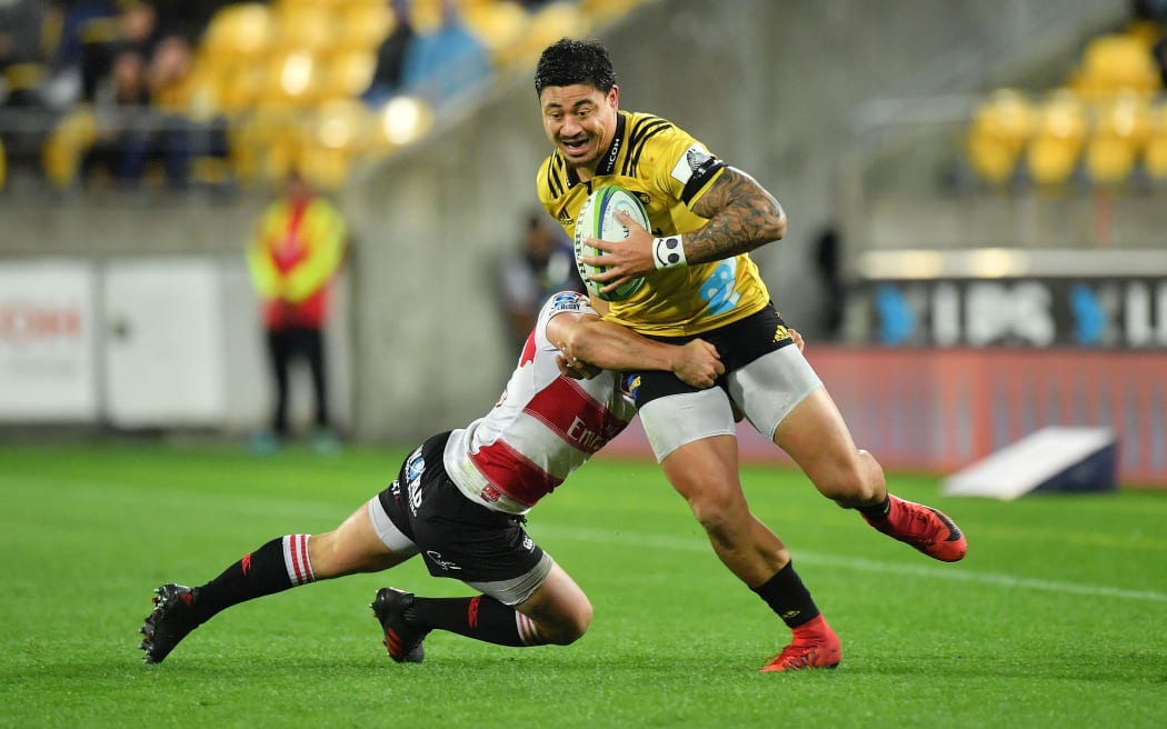 Hurricanes wing Ben Lam makes a break against the Lions.