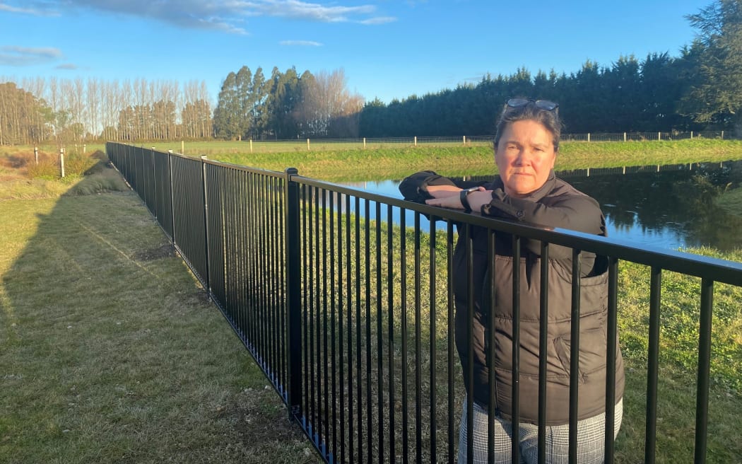 Amanda Burrows says the installation of the fence as a safety barrier between the Proctor Park playground and swales is “a complete overreaction” from the Ashburton District Council.