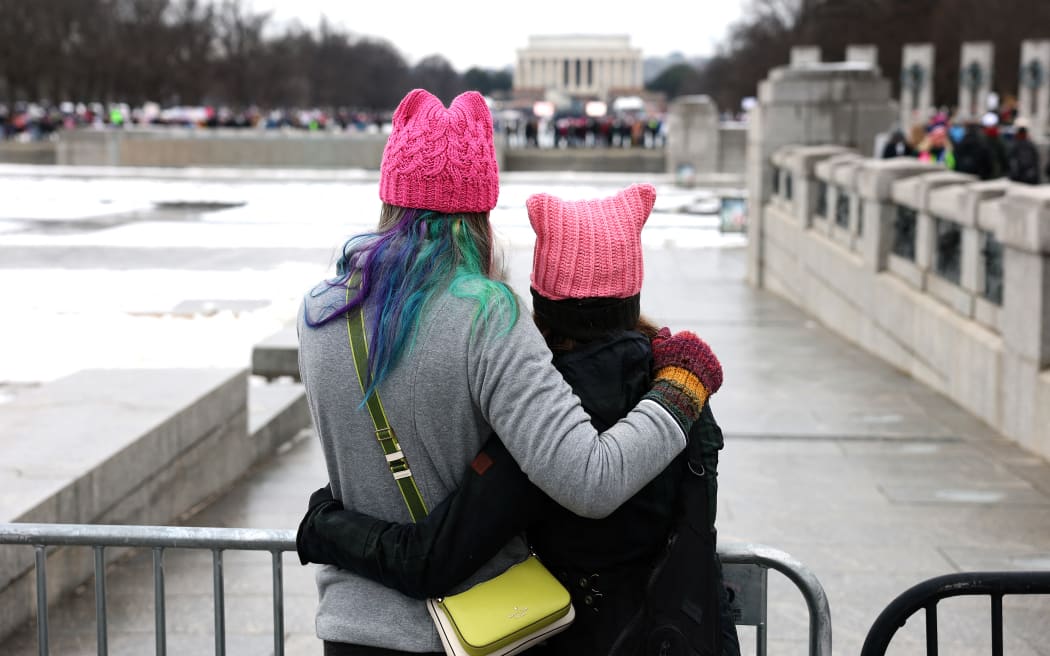 (FILES) WASHINGTON, DC - JANUARY 18: Two activists in "pussy hats" Protestors representing a variety of rights groups attend the "People's March on Washington" on January 18, 2025 in Washington, DC. Activists were rallying in opposition to the incoming Trump administration's policy objectives two days before the presidential inauguration.   Joe Raedle/Getty Images/AFP. When Donald Trump was inaugurated in 2017, opponents marched in pink knitted "pussy hats" while protesters abroad plastered streets with images of the new US president as "Star Wars" villain Darth Vader. Spool forward eight years -- after his entanglements with the law, two impeachments and divisive pardons of violent criminals -- and the vibe among the anti-Trump resistance movement isn't so much "A New Hope" as its darker sequel, "The Empire Strikes Back." (Photo by JOE RAEDLE / GETTY IMAGES NORTH AMERICA / AFP)