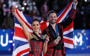 Lilah FEAR and Lewis GIBSON of the United Kingdom, bronze, pose for photos during an award ceremony for the ice dance of the ISU Grand Prix of Figure Skating Final 2025 at IG Arena in Nagoya City, Aichi Prefecture, Japan, on December 6, 2025. ( The Yomiuri Shimbun ) (Photo by Kaname MUTO / The Yomiuri Shimbun via AFP)