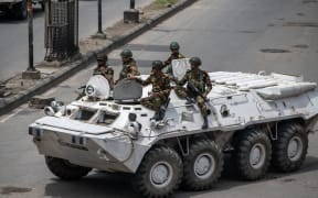 Soldiers patrolling the streets following a curfew in Dhaka, Bangladesh's capital city, on 22 July, 2024.