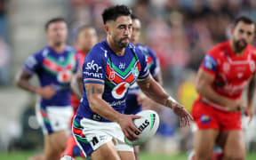 Shaun Johnson prepares to make a kick in the Warriors round one match against the Dragons.