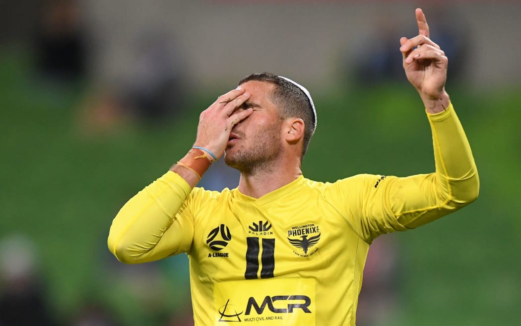 Tomer Hemed of the Phoenix reacts after scoring a goal by putting on a Kippah.