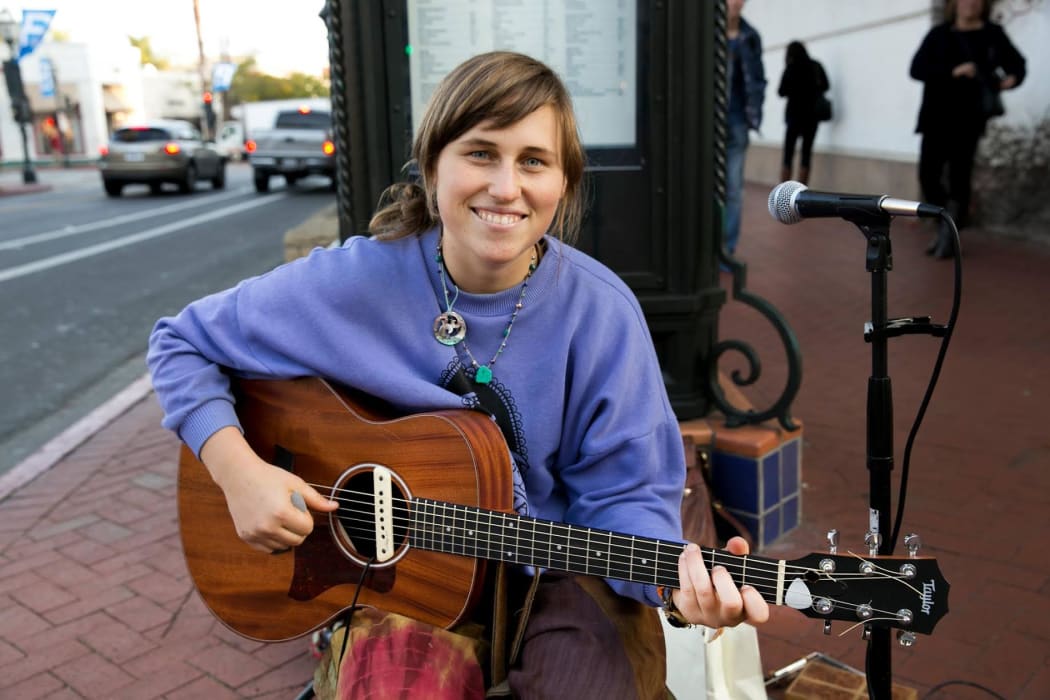 Musician Mimi Gilbert busking