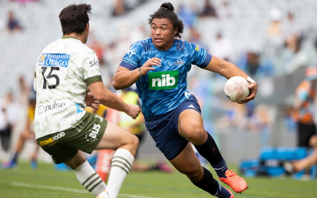 Blues winger Caleb Clarke lines up Highlanders fullback Connor Garden-Bachop.