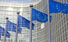 Flags in front of the EU Commission building in Brussels.