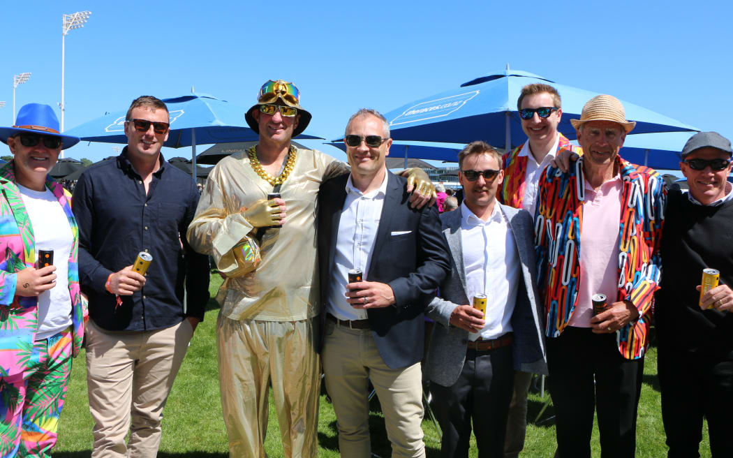 A diverse range of attire on show among this group of patrons.