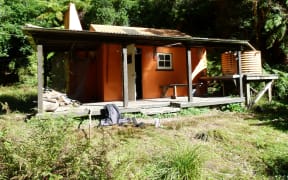 One of the Department of Conservation back country huts in Te Urewera given historic status within the department, Waiotukapiti Hut, is a rare totara-slab hut built in the 1950s by the Department of Internal Affairs as a base for deer cullers.