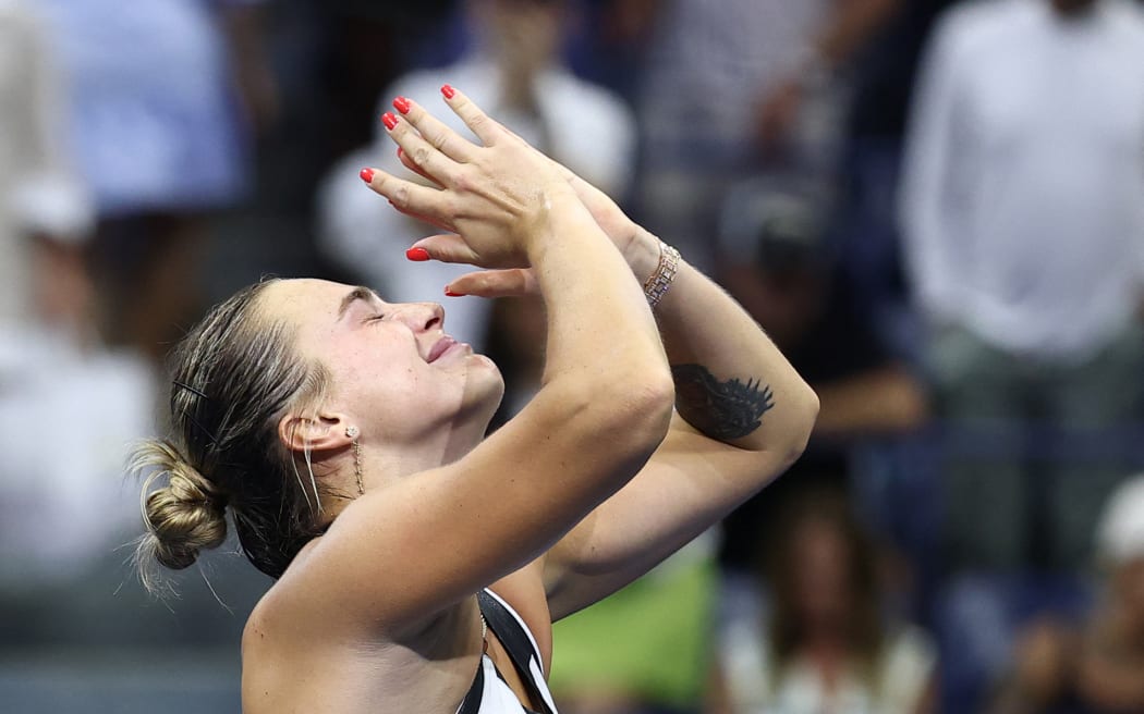 Belarus's Aryna Sabalenka reacts after defeating USA's Amanda Anisimova during their women's singles final tennis match on day fourteen of the US Open tennis tournament at the USTA Billie Jean King National Tennis Center in New York City, on September 6, 2025. (Photo by CHARLY TRIBALLEAU / AFP)