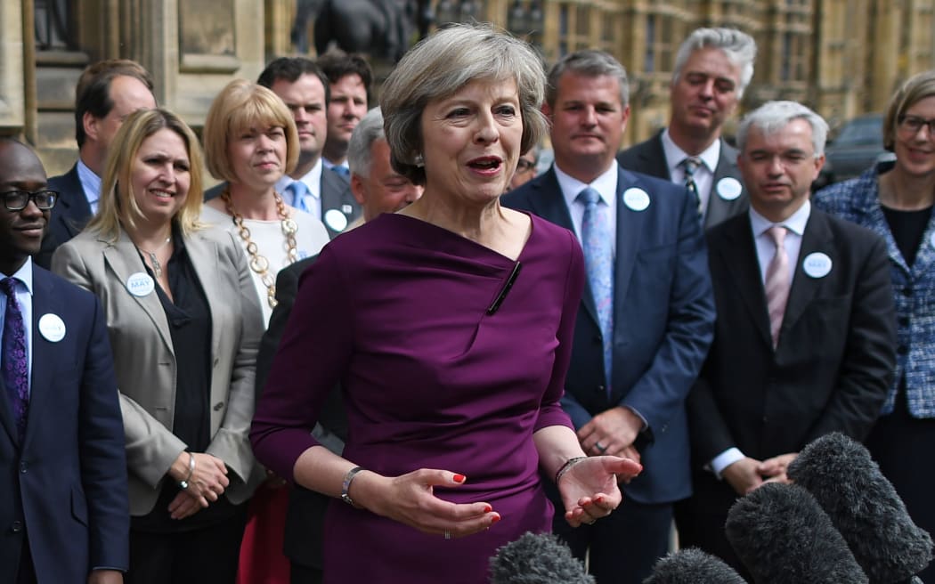 British Conservative party leadership candidate Theresa May speaks to members of the media at The St Stephen's entrance to the Palace of Westminster in London on July 7, 2016.