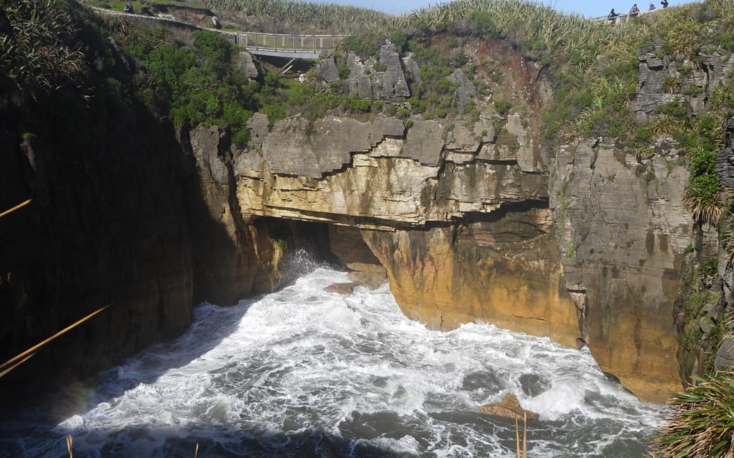 A view of the surge pool with undercut geology over which the Dolomite Point Track at Punakaiki passes.