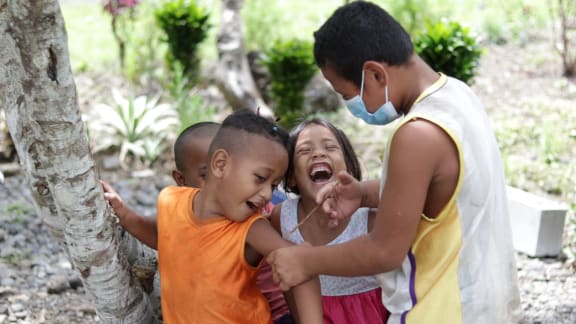 Meanwhile the village kids are getting the message about vaccination. Face masks are a common sight in Samoa.