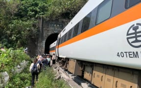 This handout picture taken and released by on April 2, 2021 by Taiwan's Central Emergency Operation Center shows the scene of where a train derailed inside a tunnel in the mountains of Hualien, eastern Taiwan.