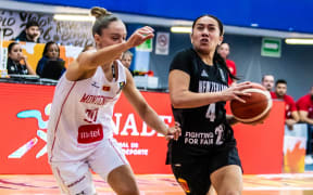 Pahlyss Hokianga-Heather drives to the hoop during the Tall Ferns game against Montenegro