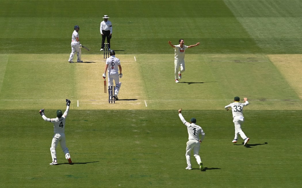 ADELAIDE, AUSTRALIA - DECEMBER 18: Pat Cummins of Australia celebrates after dismissing Zak Crawley during day two of the Third Test Match in the 2025-26 Ashes Series between Australia and England at Adelaide Oval on December 18, 2025 in Adelaide, Australia. (Photo by Philip Brown/Getty Images)