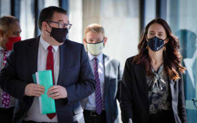 Jacinda Ardern and Grant Robertson arriving the Traffic Light System announcement