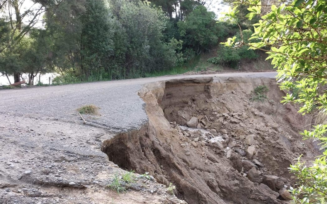 Damage on Waihau Road, where it is acting as a dam against a small lake in Dartmoor near Napier.