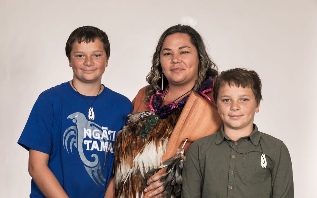 Taranaki woman Rangimokoi Knuckey with her sons.