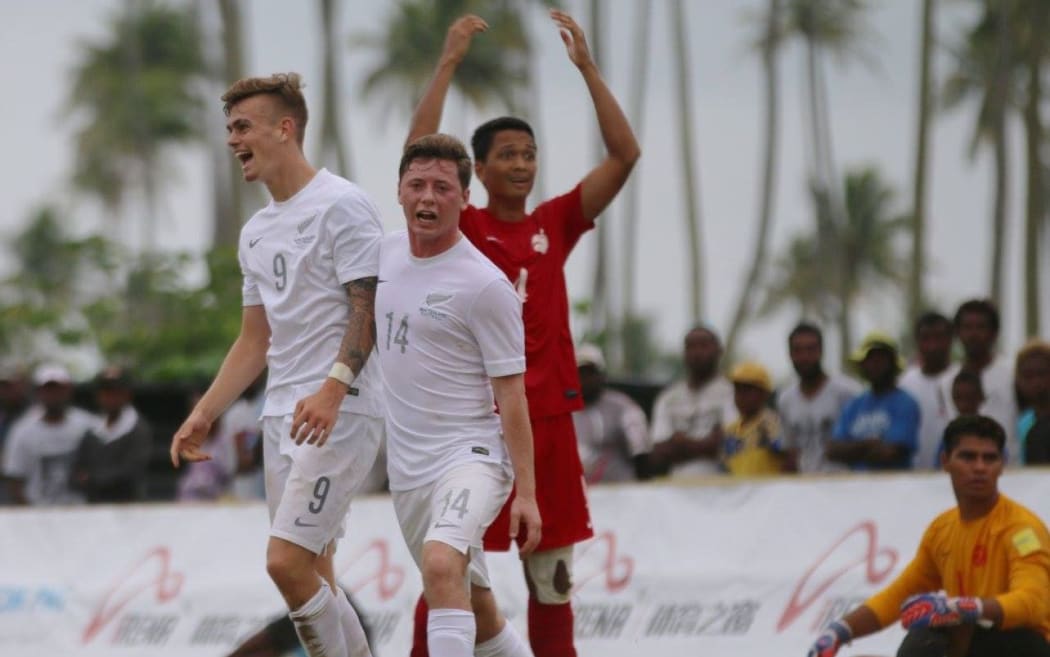 New Zealand celebrate the fourth and final goal courtesy of Myer Bevan (L).