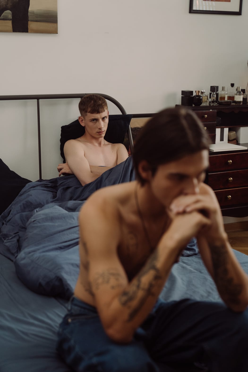 two men in bed