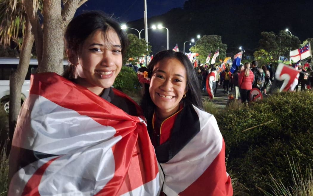 Josephina Lasini and Ali Commane at the Petone overbridge. Josephina is taking part in the hīkoi while on crutches.