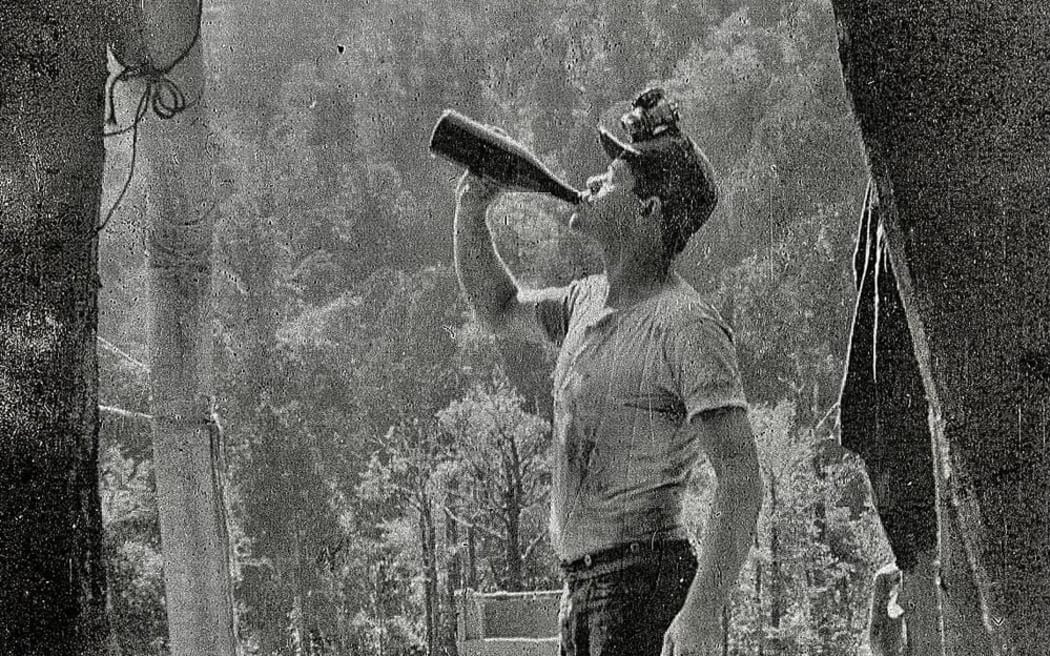 West Coast Miner drinking from bottle
