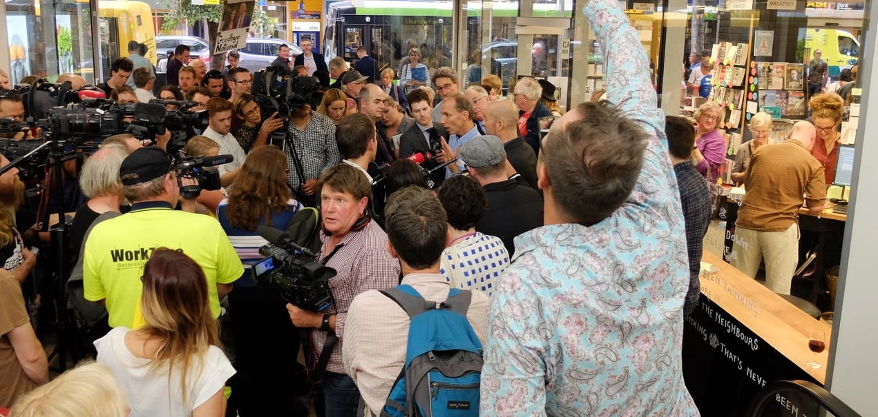 Nicky Hager and Jon Stephenson in a media scrum at the launch of 'Hit and Run.'