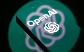 The OpenAI logo is displayed on a mobile phone screen, in February 2026.