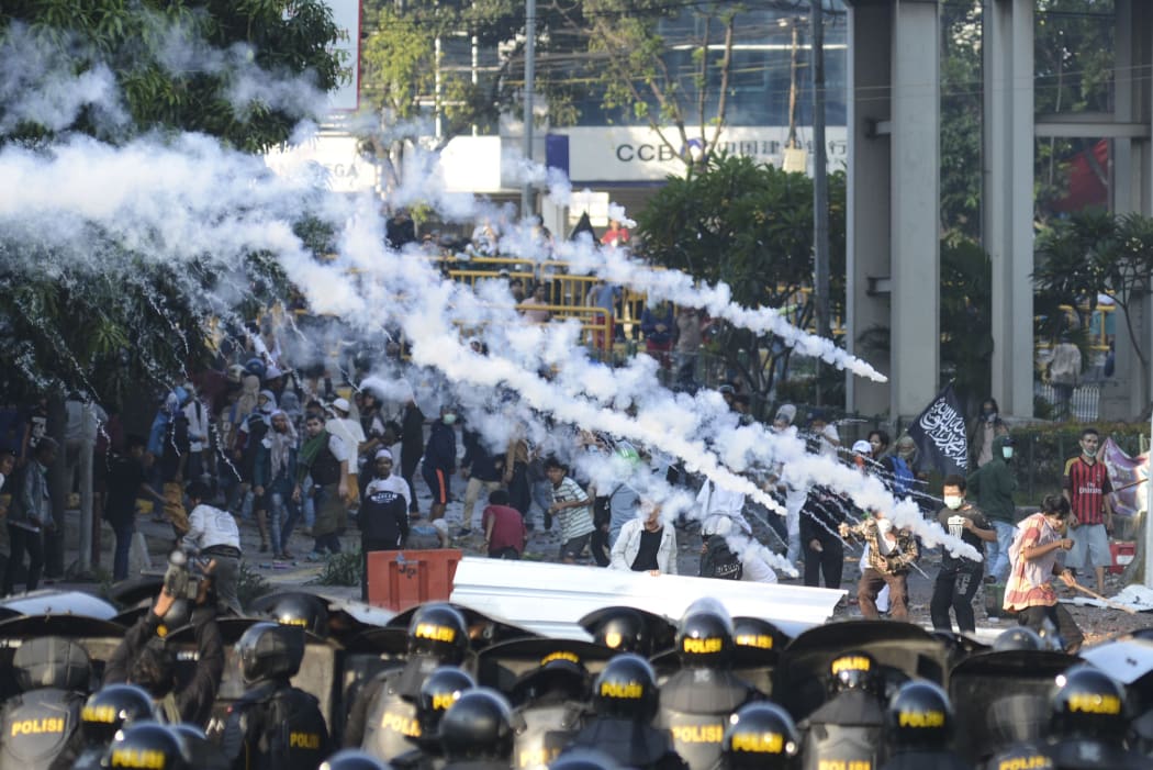 Police fired tear gas during a clash with mobs in the Tanah Abang Market area, Jakarta, Indonesia on Wednesday morning 22 May 2019.