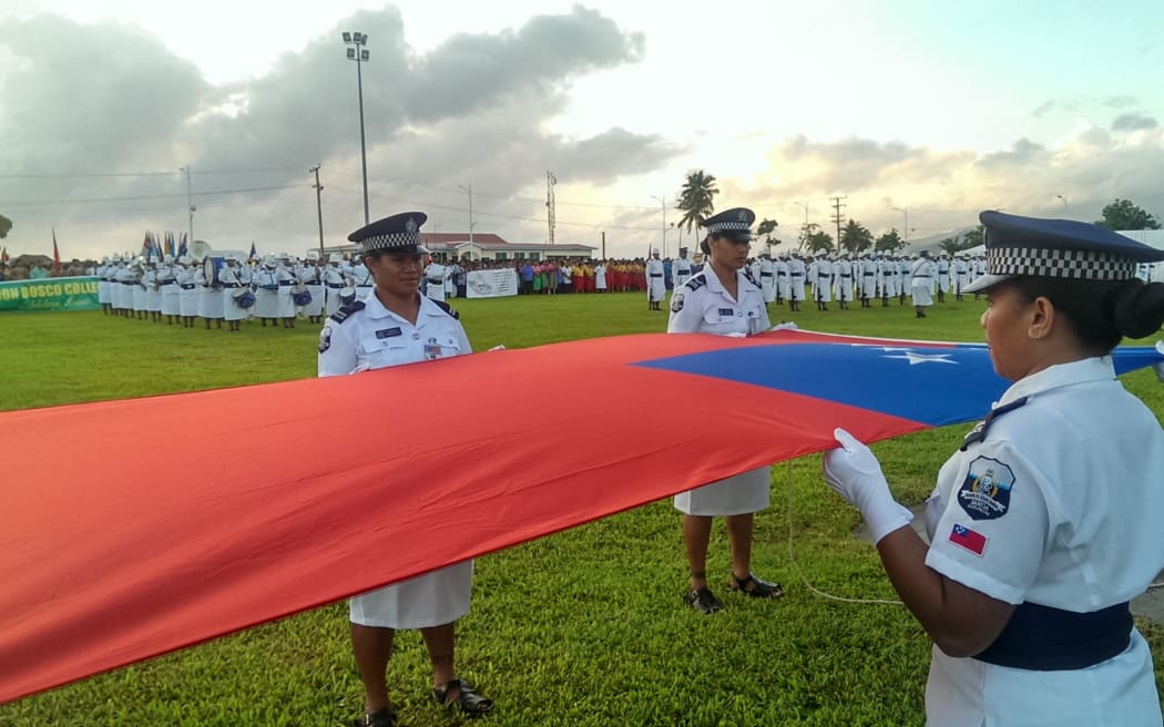 Members of the Samoan Police Force preparing to raise the national flag at Independence Day celebrations in Apia.