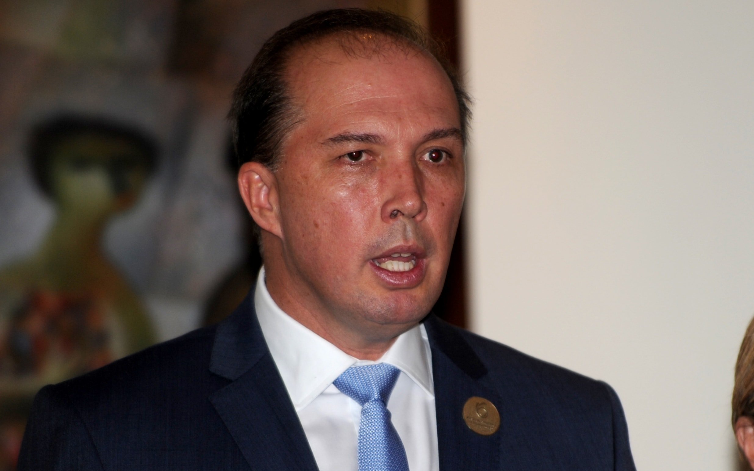 Australian Immigration Minister Peter Dutton (L) and Australian Foreign Minister Julie Bishop address journalists during a press conference in Nusa Dua, Bali on March 23, 2016.