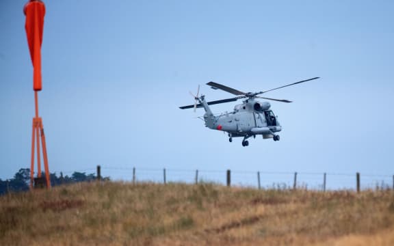 An airforce helicopter leaves Whakatāne Airport as it assists with the recovery of the eight bodies on White Island.