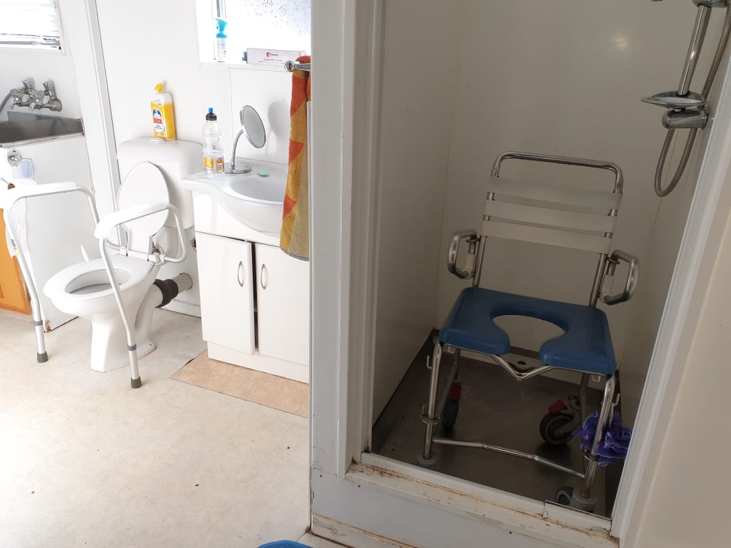 There's a huge step to get into the shower for Josh Perry and he says the toilet should be replaced too.