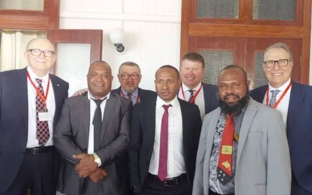 The directors of Epoca Group Ltd, Gilberto Maggiolo (far left) and Antonio Bosso (far right) were in PNG when the deal was signed in October.
