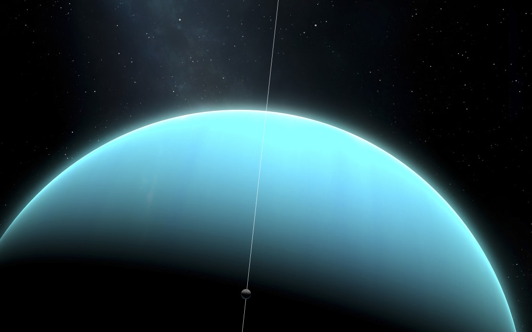 An impression of the green ice giant planet, Uranus, with one of its moons, Miranda. Uranus is the seventh planet in order of distance from the Sun, orbiting at an average distance of 2.85 billion km. It is unusual in that it has a very pale, almost featureless atmosphere, and an axial tilt close to 100 degrees (Photo by MARK GARLICK/SCIENCE PHOTO LIBRA / MGA / Science Photo Library via AFP)