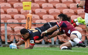 Daniel Rona scores a try during the Chiefs and Highlanders clash at FMG Stadium in Hamilton.