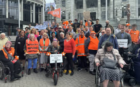 Access Matters lead campaigner Juliana Carvalho / all the people who marched to Parliament to deliver a petition calling for redrafting in co-design the Accessibility Bill.