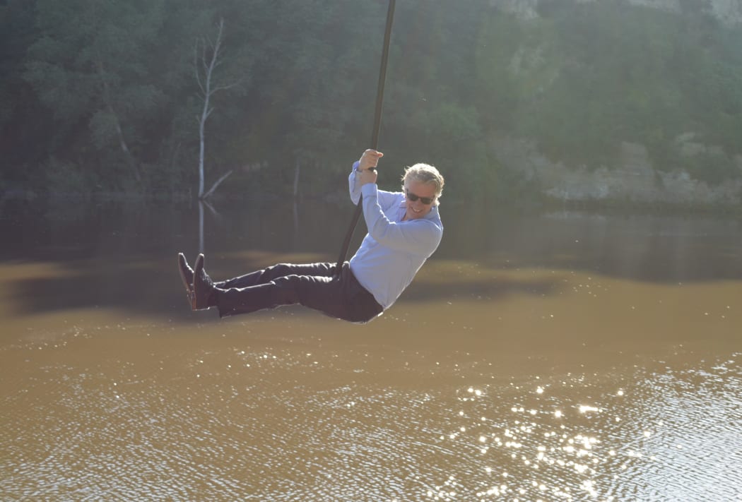 Whanganui Mayor Hamish takes a ceremonial swing over the river.