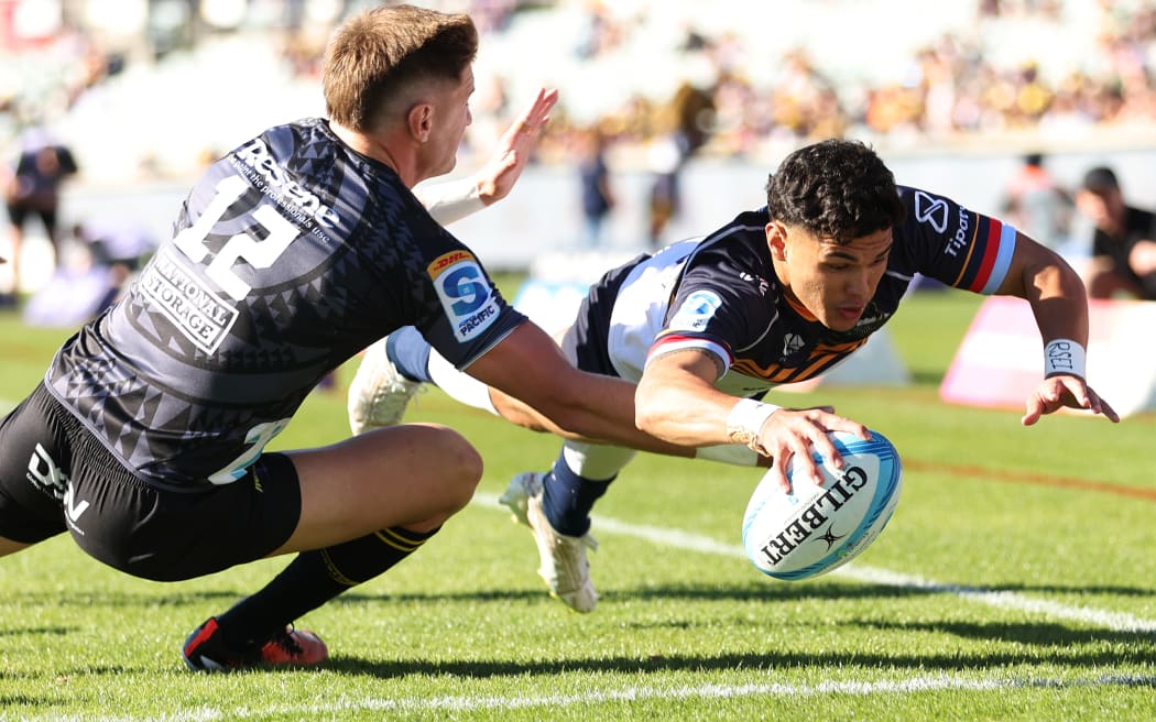 CANBERRA, AUSTRALIA - APRIL 27: Noah Lolesio of the Brumbies scores a try during the round ten Super Rugby Pacific match between ACT Brumbies and Hurricanes at GIO Stadium, on April 27, 2024, in Canberra, Australia. (Photo by Mark Metcalfe/Getty Images)