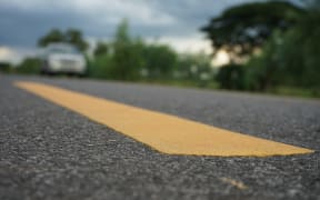 Road traffic paint on the asphalt surface to ensure safety. Roading, car, road, tarmac.