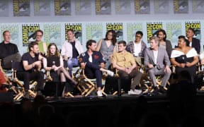 SAN DIEGO, CALIFORNIA - JULY 26: (L-R) Yvette Nicole Brown, Patrick Mckay, Charlie Vickers, JD Payne, Morfydd Clark, Daniel Weyman, Benjamin Walker, Megan Richards, Robert Aramayo, Tyroe Muhafidin, Charles Edwards, Maxim Baldry, Sophia Nomvete, Ismaël Cruz Córdova, Ema Horvath, Lloyd Owen, Trystan Gravelle and Cynthia Addai-Robinson speak onstage during "The Lord Of The Rings: Rings Of Power" Panel during 2024 Comic-Con International at San Diego Convention Center on July 26, 2024 in San Diego, California.   Matt Winkelmeyer/Getty Images/AFP (Photo by Matt Winkelmeyer / GETTY IMAGES NORTH AMERICA / Getty Images via AFP)