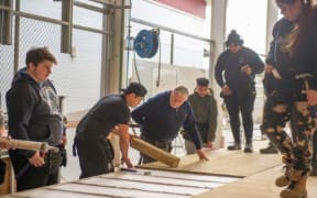 A tutor teaching trades students at UCOL polytechnic, in the lower North Island.