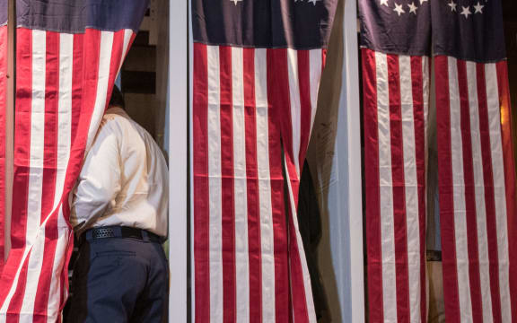 Seven voters choose their candidate at midnight on on November 8, 2016 in Dixville Notch, New Hampshire, the first voting to take place in the 2016 US presidential election.