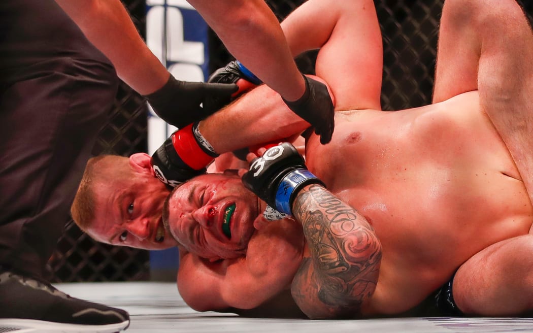 Kiefer Crosbie taps out in the rear naked choke from Kevin Jousset. UFC 293, Qudos Bank Arena, Sydney Olympic Park Australia, Sunday 10th September 2023.  Copyright Photo: David Neilson / www.photosport.nz