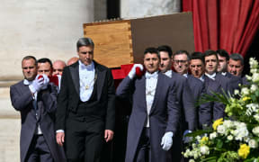 Pallbearers carry the coffin of late Pope Francis during the funeral ceremony in St Peter's Square, at the Vatican, on April 26, 2025. (Photo by Alberto PIZZOLI / AFP)