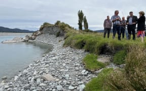 West Coast Regional council management and representatives earlier this month inspect the flood breach opened up at Waitangi weekend, and which just 48 hours later saw the river break through and severely flood farmland.