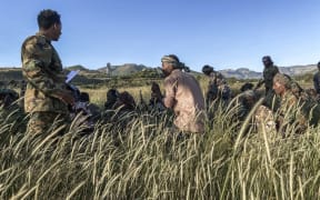 Amhara militia men, that combat alongside federal and regional forces against northern region of Tigray, receive training in the outskirts of the village of Addis Zemen.