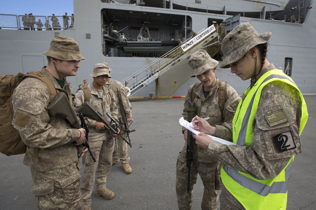 New Zealand Army soldier Private Tamika Taikato (right) records the arrival of troops at Nelson as they disembark from HMNZS Canterbury during Exercise Southern Katipo 2017.