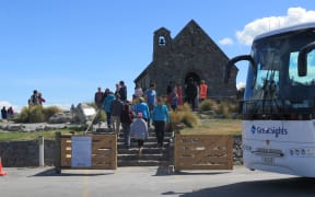 Tourists visit at the Church of the Good Shepherd in Tekapō.