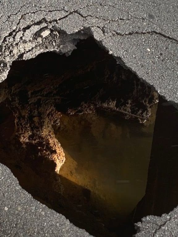 A close up of the hole that has closed a Tauranga road.